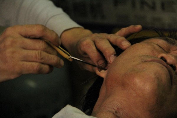 Zhang at work in his home-run shop. Photo: Winner