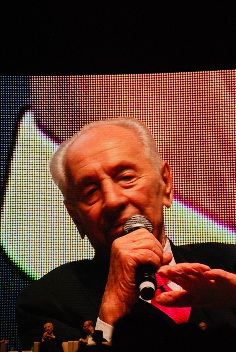 Shimon Peres, left, and Peretz Lavie, right, speak at an afternoon session on technology and the future of education in the new sports park arena. The arena features a front stage wide screen video screen and the top of the arena features a 360 degree video screen. Photo: John Noonan